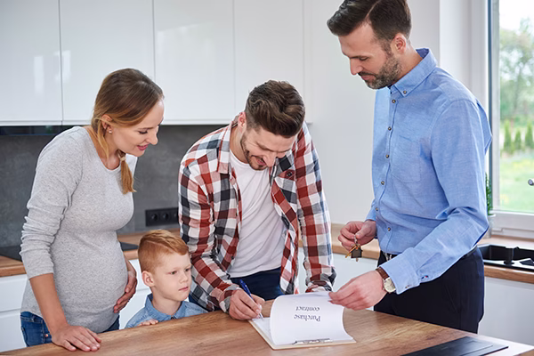 Family reviewing lower first-year mortgage payments with a temporary buydown